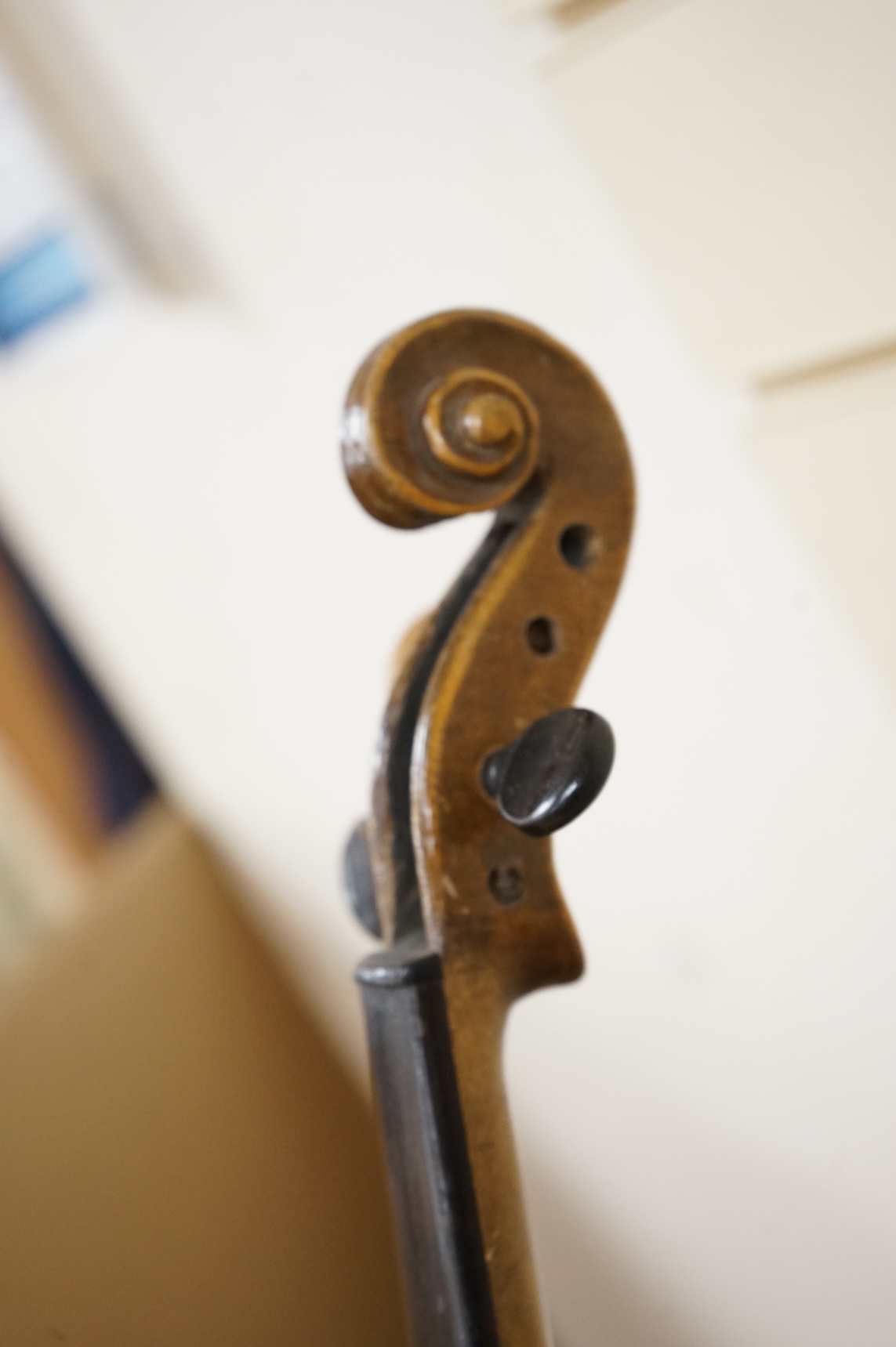 Four violins; a German Dresden violin, together with further two German violins, and a Saxony violin, three in cases or the remains of cases.